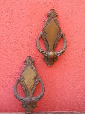 Door knockers used, two brass with patina and screws