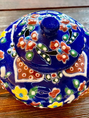 Handmade ceramic sugar bowl used with vibrant colors