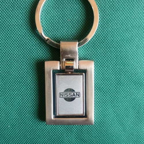 Vintage Nissan spinning keychain, New Old Stock, heavy metal 38g