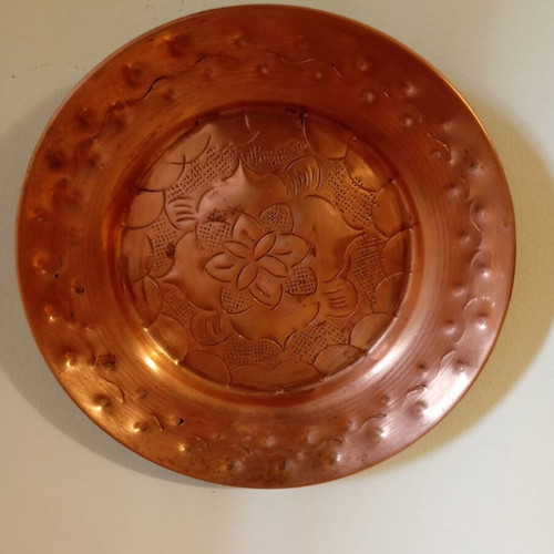 Vintage carved copper wall plate like new with embossed floral design