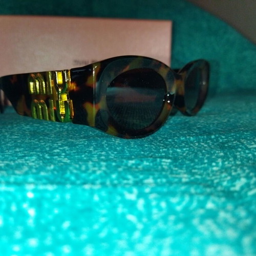 Miu Miu sunglasses new, modern brown and yellow