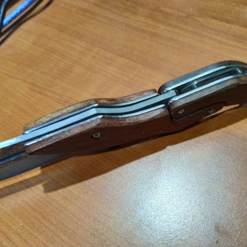 Folding knife with opening mechanism and Laser Pattern Damascus blade, like new