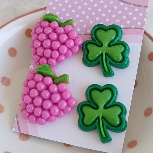 Plastic stud earrings like new, grape and clover design