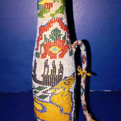 Bottle used with beads and 1924 decoration
