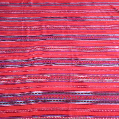 Woven blanket cover used, striped wool