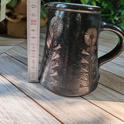 Retro ceramic milk jug with embossed flowers