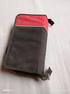 CD/DVD case used, capacity 96 discs, fabric, zipper closure