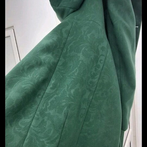 Green coat with embossed pattern like new, size 40