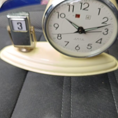 Vintage wind-up alarm clock with date like new