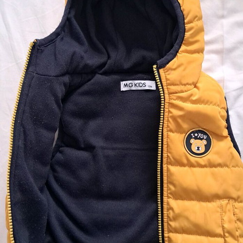 Baby sleeveless jacket used, yellow with blue lining