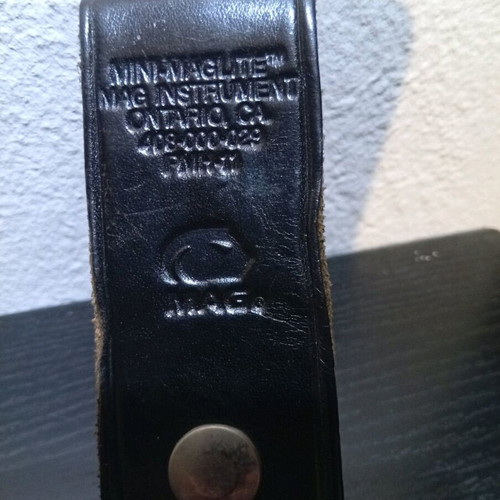 Mini Maglite flashlight belt holster used, leather