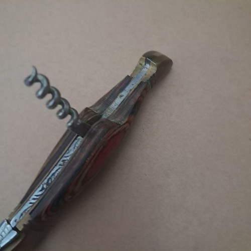 Vintage folding knife like new with multicolored wood handle