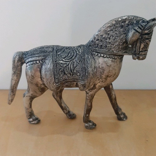 Vintage metal horse used with carved details