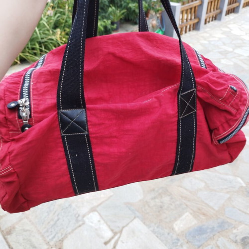 Travel sack with multiple compartments, red