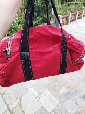 Travel sack with multiple compartments, red