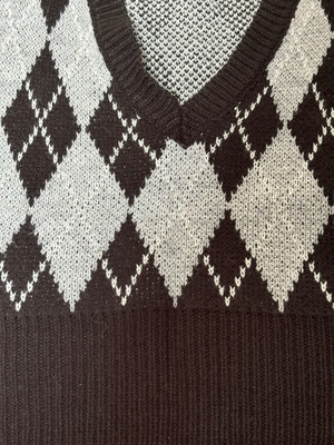 Showing sleeveless ski pullover checkered size small