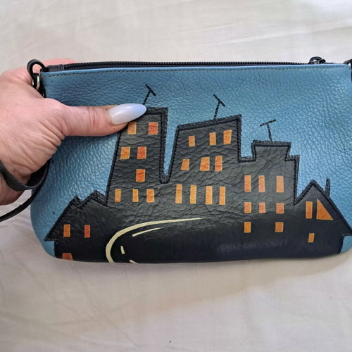 Handmade leather crossbody bag with urban design