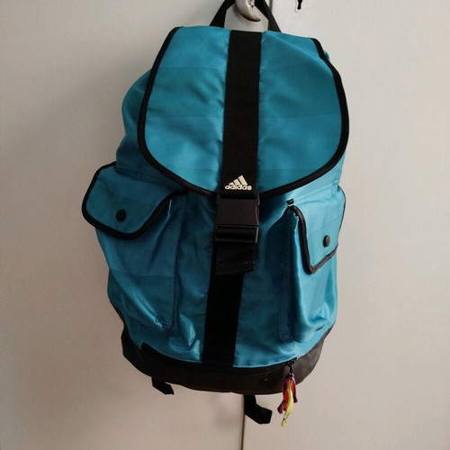 Adidas backpack used, turquoise waterproof with 2 outer pockets