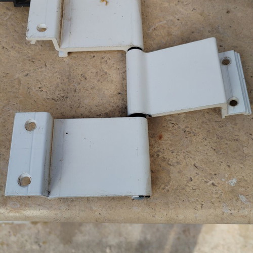 Aluminum hinges like new, 20 large and 23 small with screws and plastic