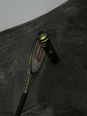 Wilson Blade V8 1000UL tennis racket used with US Open balls