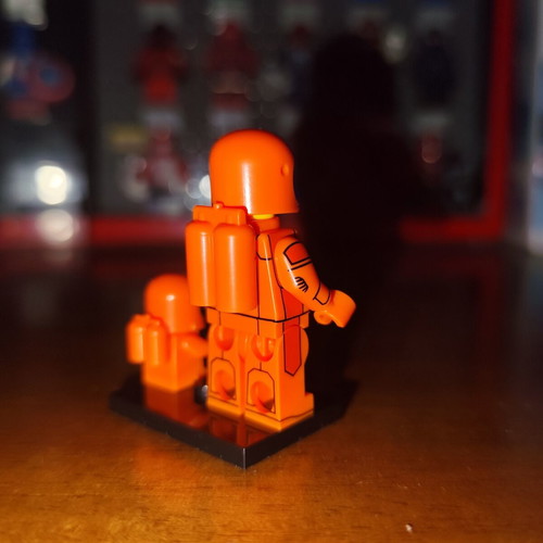 Orange Astronaut minifigure with baby and stand, Lepin