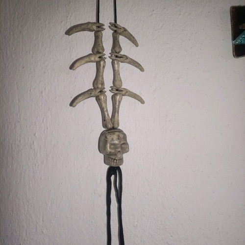 Halloween hanging decoration used with bone and skull appearance
