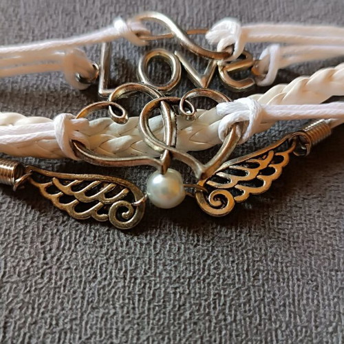 Love bracelet set new with white cords and charms