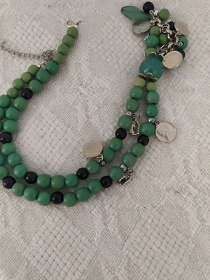 Necklace like new with green stones and small coin charms
