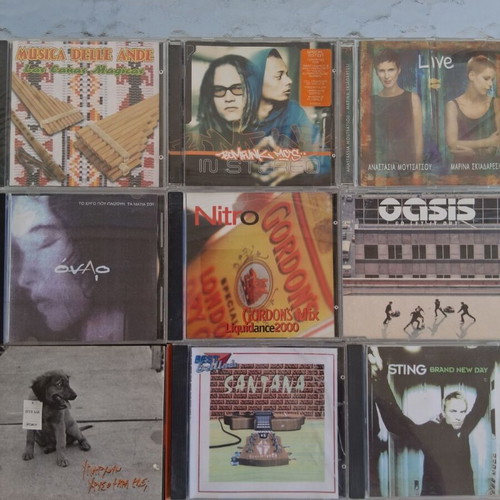 10 CD music collection including Oasis, Sting, Santana, Nitro
