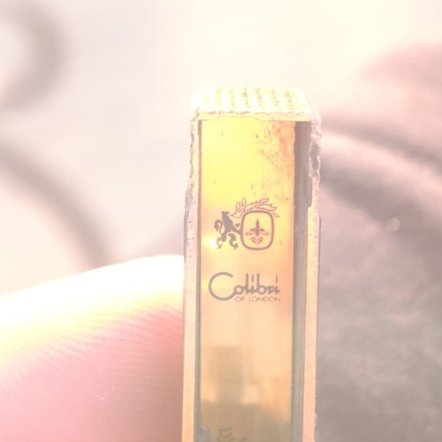 Colibri of London vintage lighter used, gold plated with black lacquer