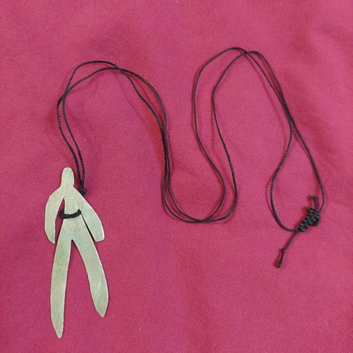 Handmade necklace used with human figure shape and adjustable cord