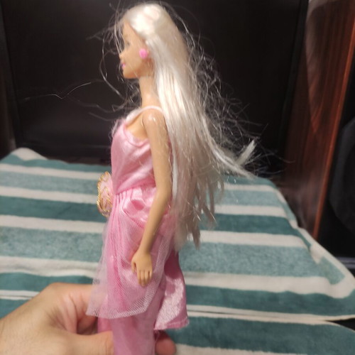 Barbie doll used with dress tears