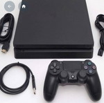 PlayStation 4 console with broken fan, used, includes two controllers
