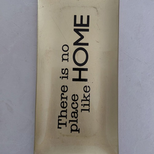 Decorative gold platter used with "There is no place like HOME" inscription