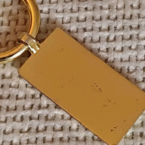 Authentic Prada gold key ring unisex like new