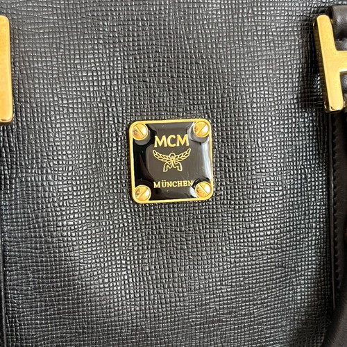 MCM black handbag with gold metal like new