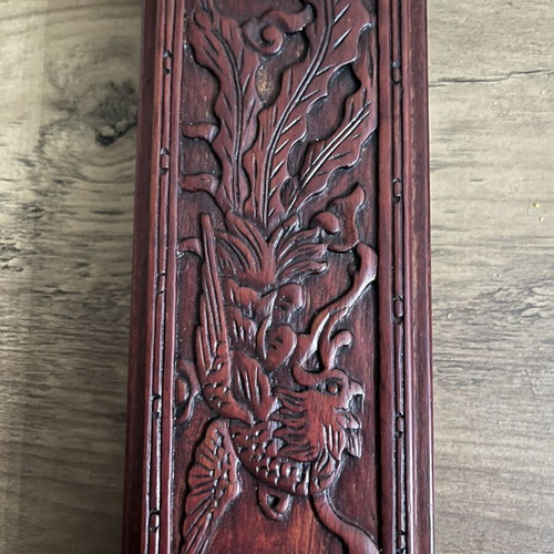 Japanese wooden box with 16 used chopsticks and palm carving