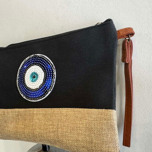 Black clutch bag with blue eye and leather strap new