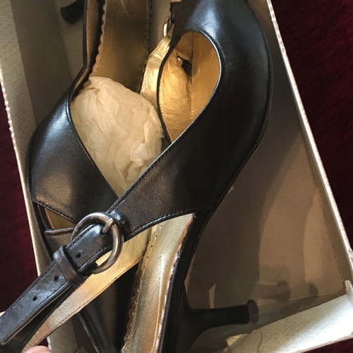 Black leather women's sandals used with low heel