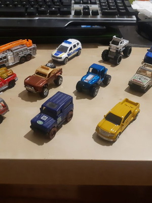 Lot of 13 4x4 toy cars and 1 fire truck