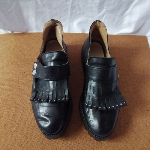 Women's black leather loafers with tassels and snap buttons, size 37