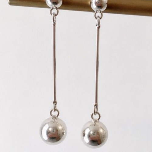 Long geometric drop earrings with silver spheres