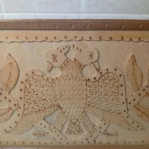 Vintage wood-carved plate like new with double-headed eagle