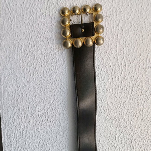 Belt used from faux leather with impressive brown buckle