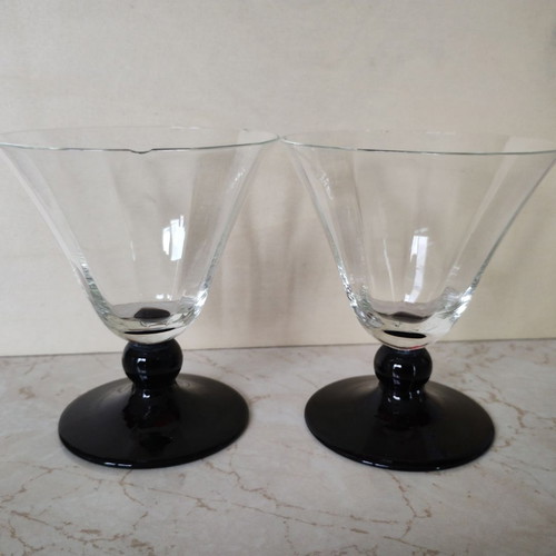 Vintage thin-walled glass glasses with black stem used, retro style