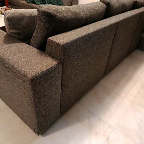 Three-seater sofa used in gray color with two cushions