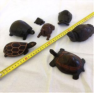 Collection of small wooden hand carved ornamental tortoises. They are from different countries.