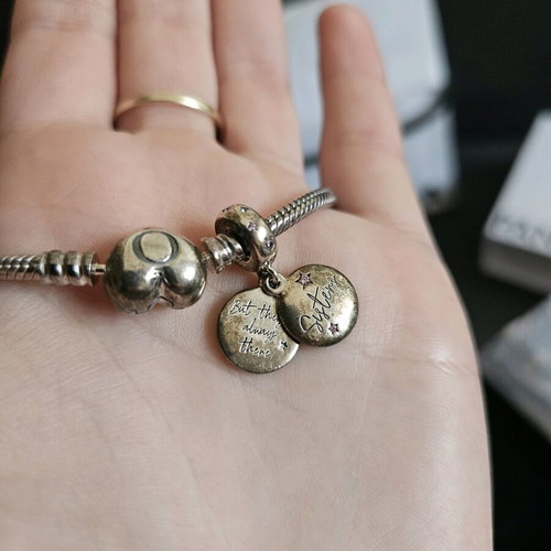 Pandora sterling silver charm bracelet with heart and sister charms like new