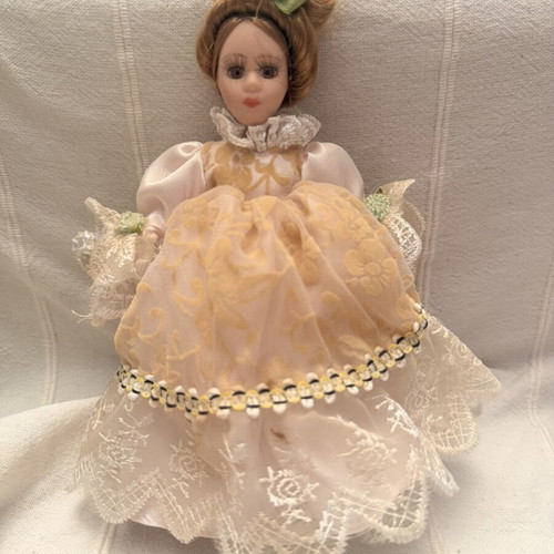 Porcelain doll vintage used, girl on stand