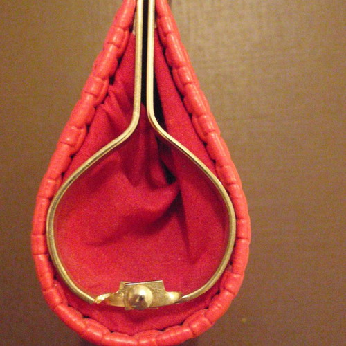 Small red wallet with gold clasp used